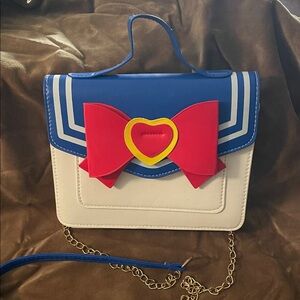 Sailor Moon front flap bag with magnetic closure and chain crossbody strap